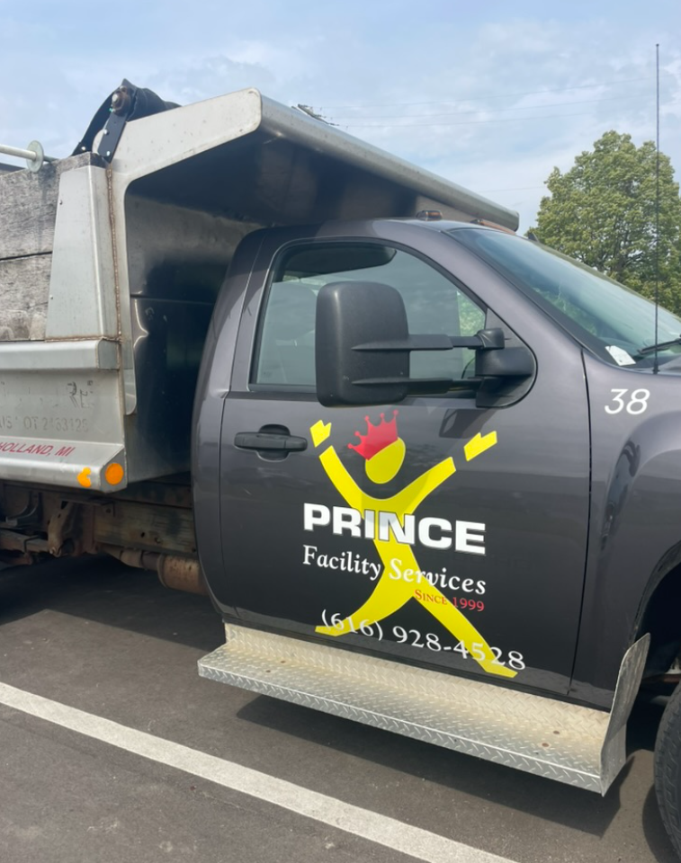 Car wrap for Prince Facility Services produced by Schreur Printing in Holland Michigan