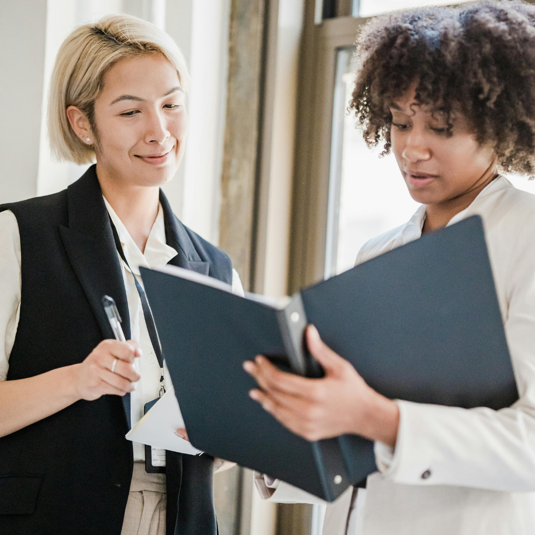 Employees reading onboarding packet