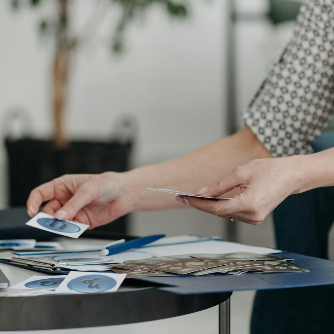 Woman holding business cards