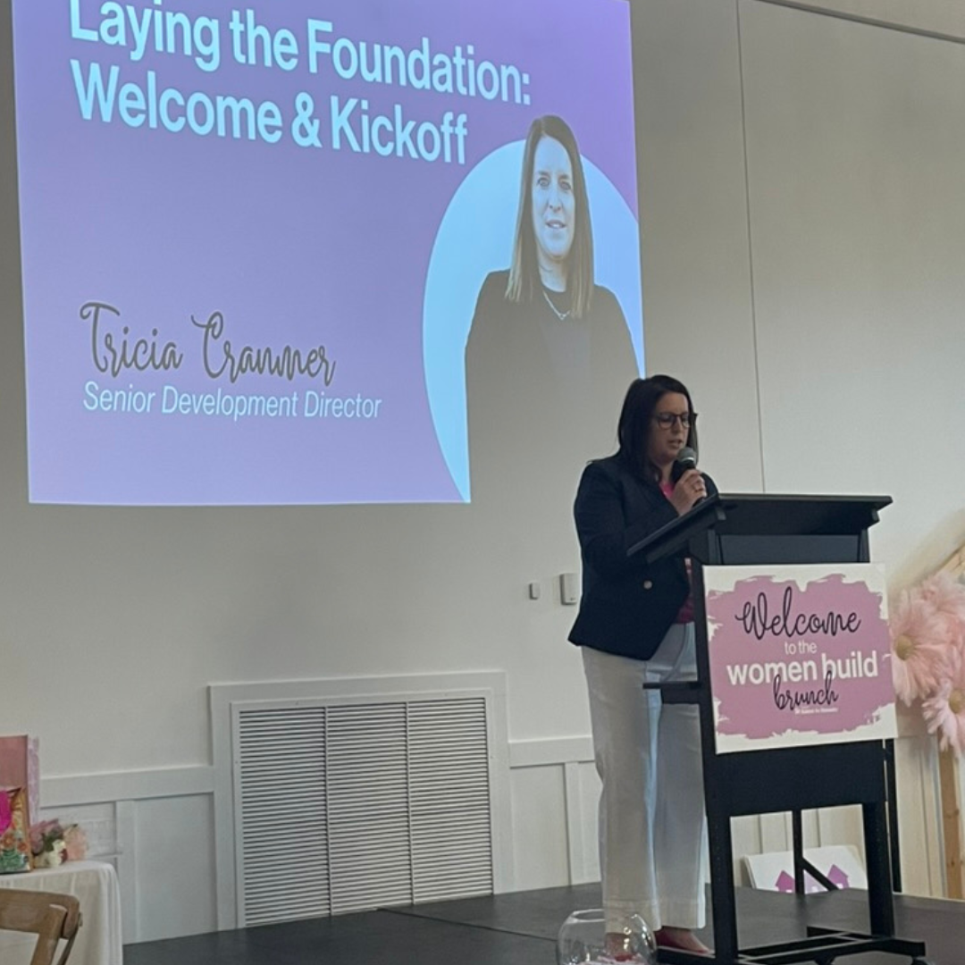 Women build brunch signage and presentation